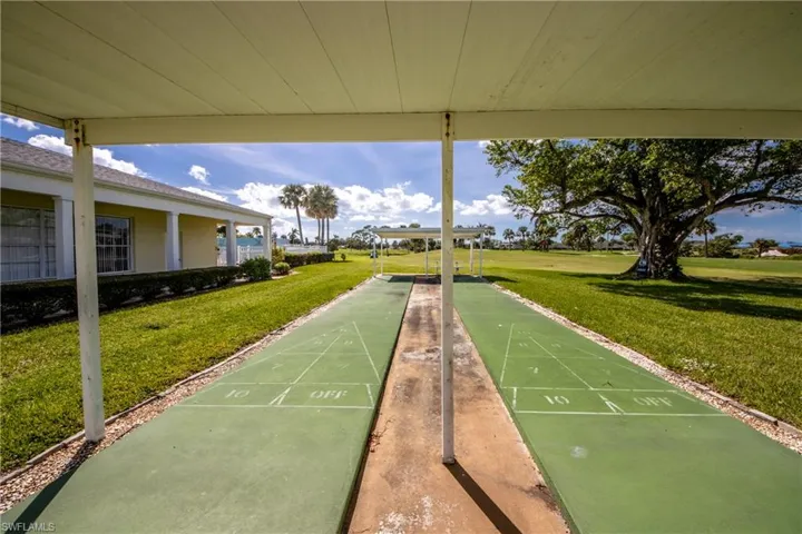 View of community featuring a lawn