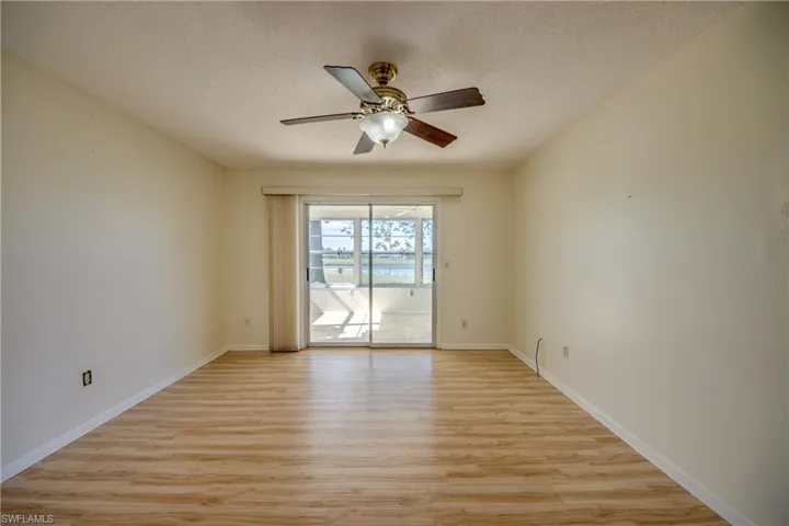 Unfurnished room with light hardwood / wood-style floors, a textured ceiling, and ceiling fan