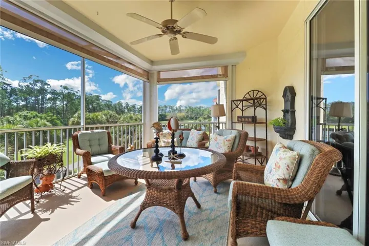 Large screened in balcony with motorized shades