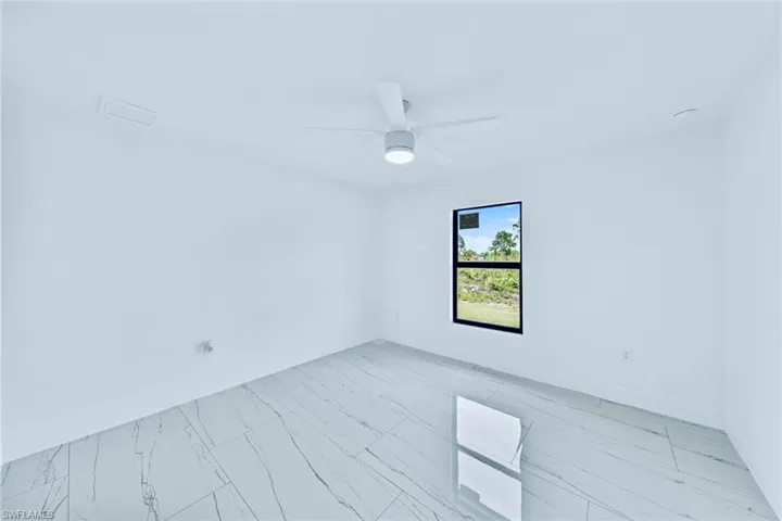 Unfurnished room with ceiling fan