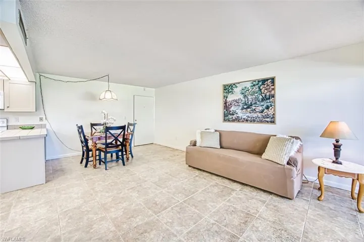 Living area with light tile patterned floors