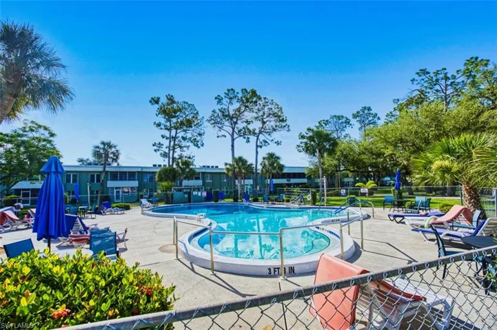 Community pool featuring a patio