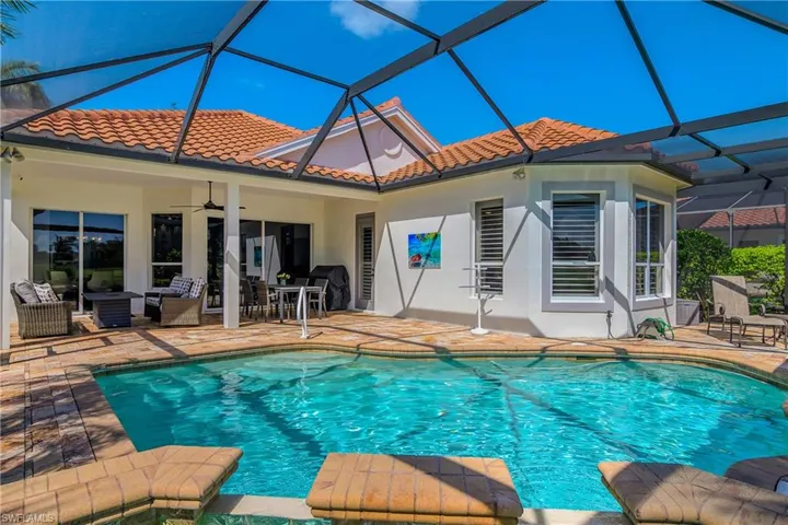 Pool and spa heated by economical natural gas...heater new in 2025. Area to right is master bedroom suite and more lanai space.