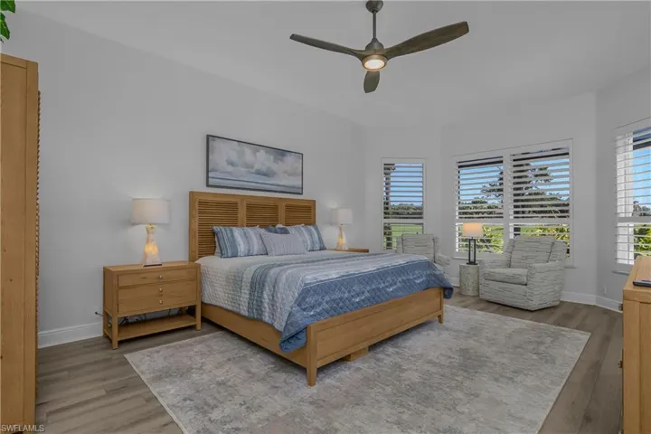Master bedroom suite with enlarged sitting area at windows.