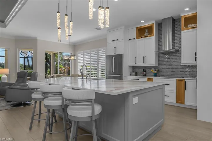 The quartz-topped 10'x5' center island provides plenty of storage space in the double/back-to-back 24" deep cabinets below.