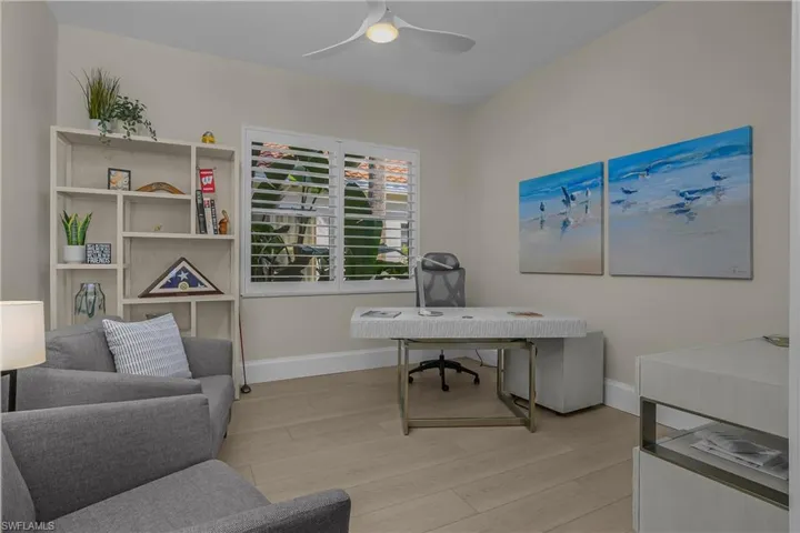Den with comfortable chairs that provide two single beds.