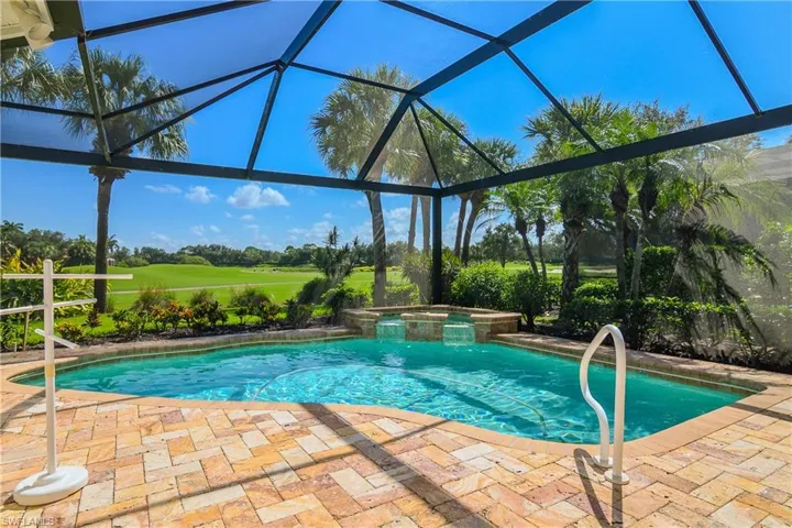 New lanai pool cage with "picture window," travertine stone deck.