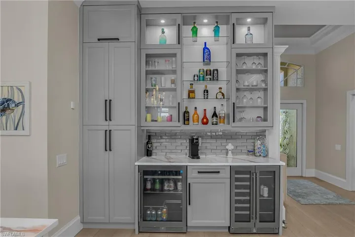 Kitchen pantry is to the left of the 2 refrigerated bar units that hold plenty of beverages with your choice of 3 temperature-controlled settings.
