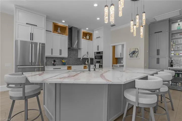 Bosch top-tier kitchen appliances sync directly to your smartphone. Heat the oven after putting out on #18 green. Note 4 bar stools at center island for informal dining.