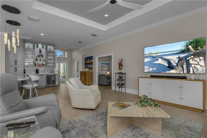 Great room architecture and it's all been remodeled to reflect today's ambiance, function and livability. High end fit and finish, luxury vinyl flooring throughout, new ceiling fans, new LED lighting and plantation shutters at windows.