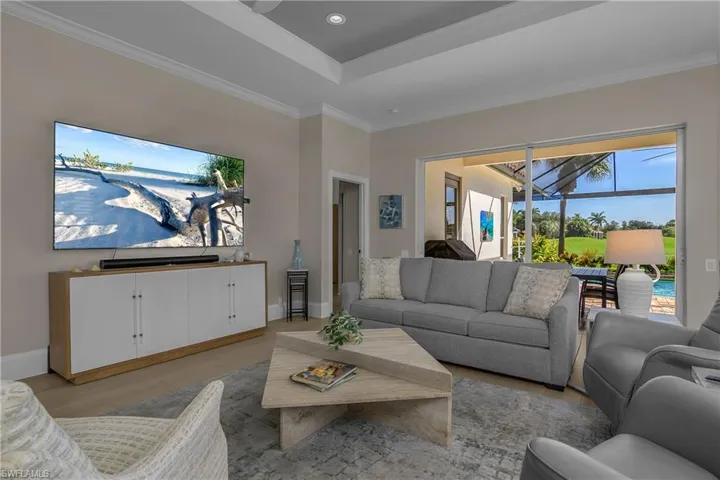 Casual, informal, serene and relaxing. Note trey ceiling and sliders to the lanai.