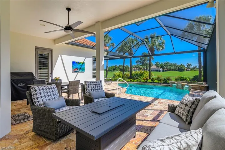 Pool and spa sun drenched but a generous area for shade and relaxation.  Portable grill on back wall. Note that the lanai is extended and enlarged in back of the master bedroom suite.