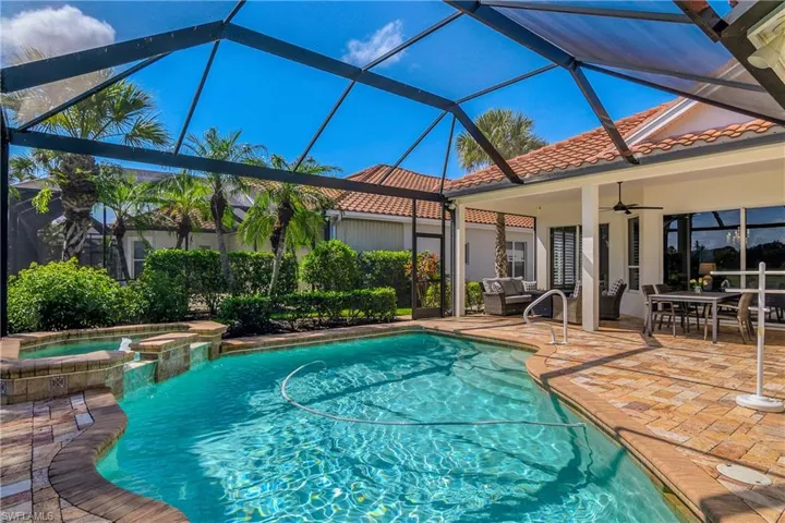 Sparkling pool/spa and picture window. Pool cleaned by vacuum system which can be removed when pool is being used.