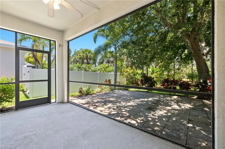 Unfurnished sunroom with ceiling fan