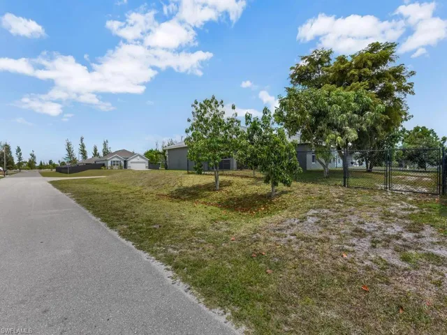 Wide Double Gate Entry On Side Of Property