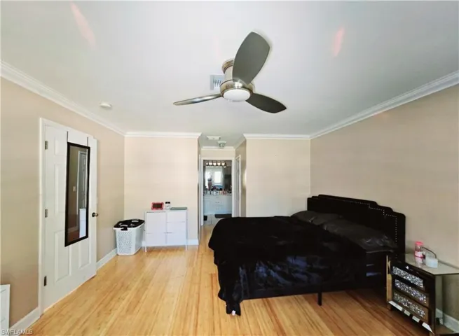 Master Bedroom with ceiling fan, light hardwood / wood-style flooring, and crown molding