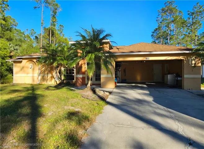 View of front of home with an open garage