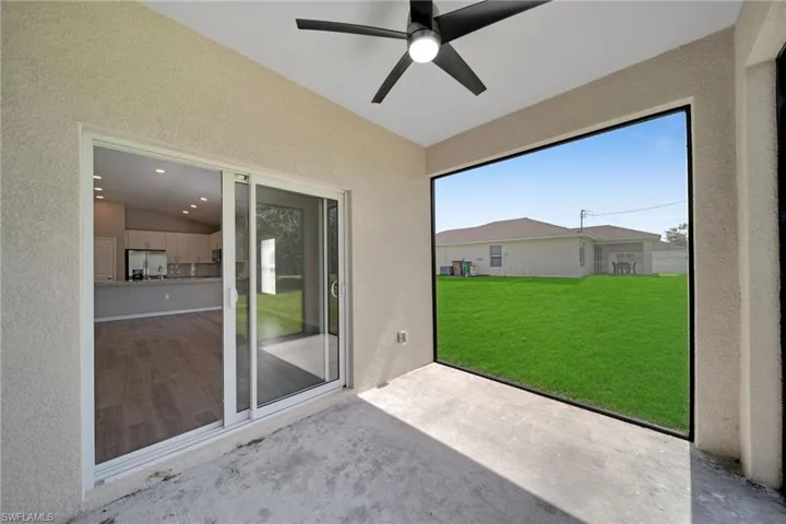Unfurnished sunroom with lofted ceiling and ceiling fan