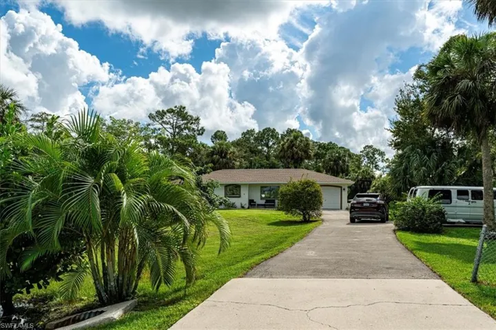 Long paved driveway with extra parking