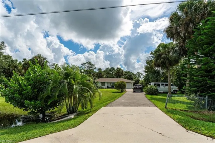 Long paved driveway with extra parking