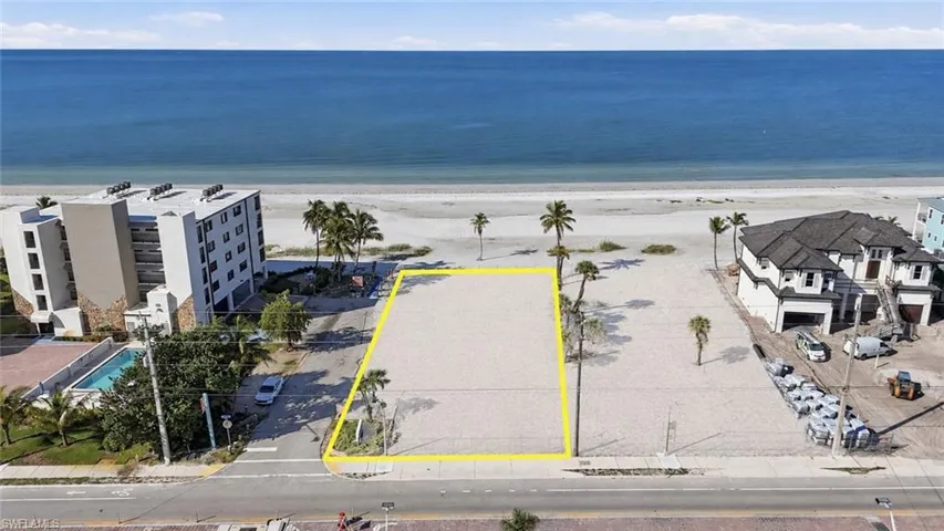 Beachfront lot featuring direct beach access, proximity to the ocean, and clear development potential - Virtually Edited Image