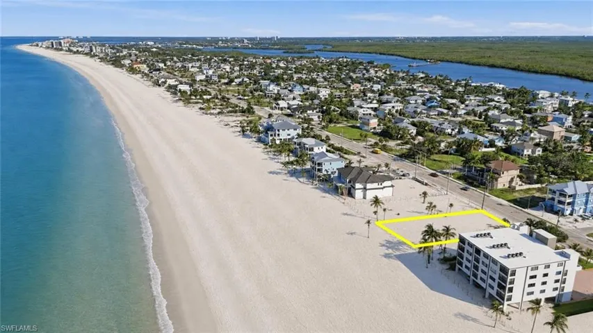 Expansive beachfront lot bordered by a paved road - Virtually Edited Image