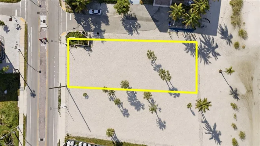 Beachfront lot featuring direct beach access, proximity to the ocean, and clear development potential - Virtually Edited Image