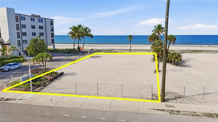 Beachfront lot featuring direct beach access, proximity to the ocean, and clear development potential - Virtually Edited Image