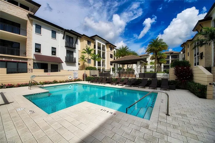 Community pool with a gazebo and a patio area