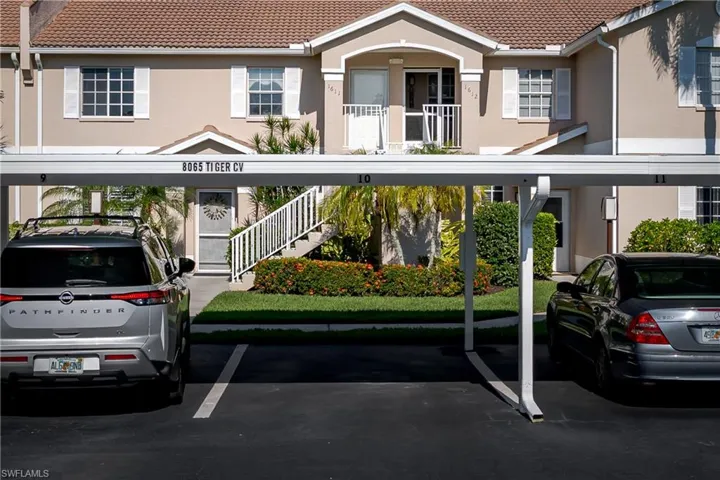 Front of condo, view of parking and front entrance