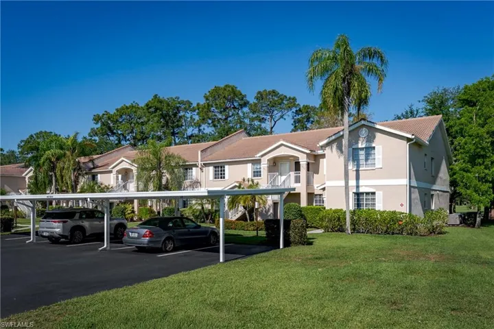 Front of condo, view of parking and front entrance
