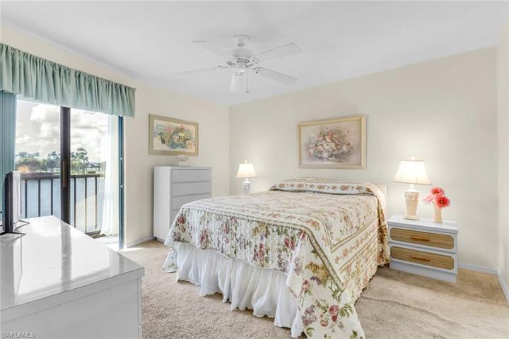 Lovely master bedroom with view of the lake.