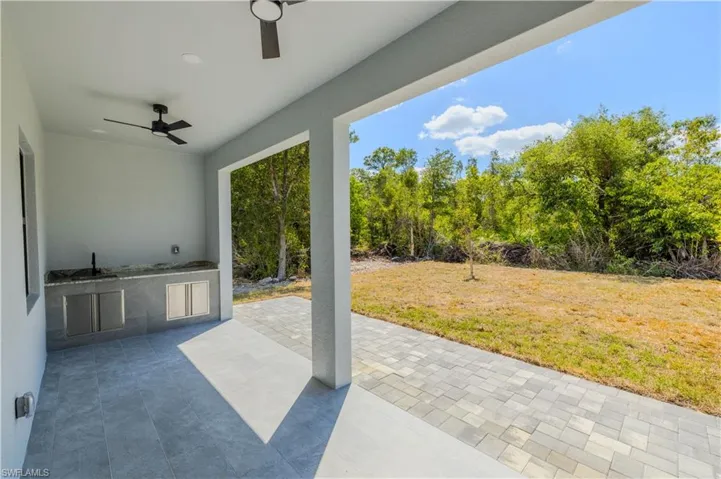 View of patio / terrace featuring exterior kitchen and a ceiling fan
