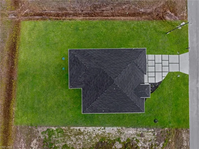 Single-story property with a dark shingle roof