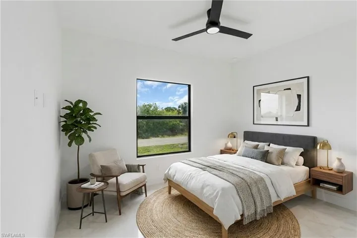 Virtually Staged.  Bright room featuring a black framed window, recessed lighting, and a contemporary ceiling fan