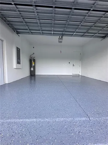 Garage with electric water heater and electric panel