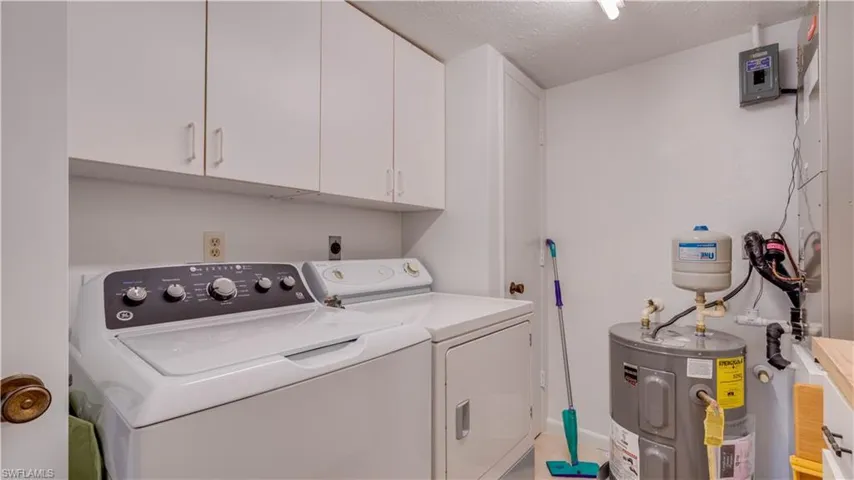 Laundry room has door to back of Primary Bath linen closet