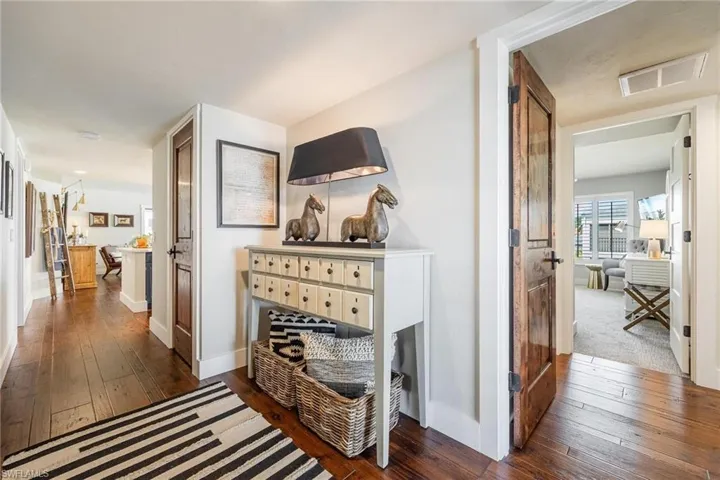 Corridor with dark hardwood floors
