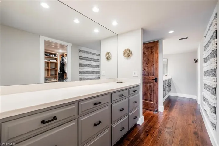 Master Bathroom with vanity and wood flooring