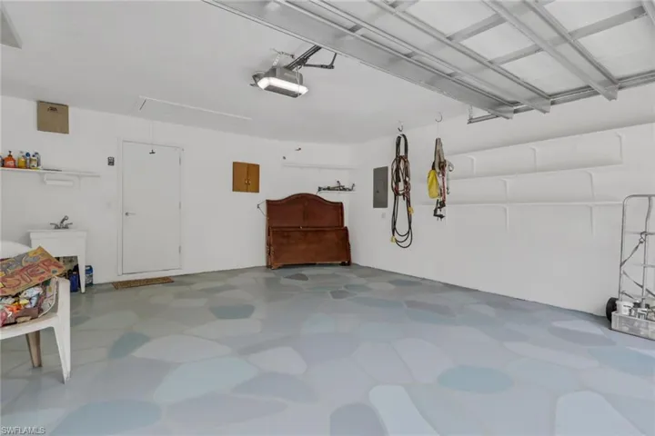 Spacious two car garage with utility sink. Hurricane proof garage door.