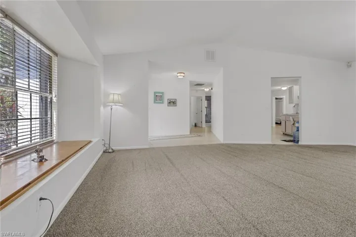 Spacious front living area with window seating giving you added storage. High ceilings and tons of natural lighting.