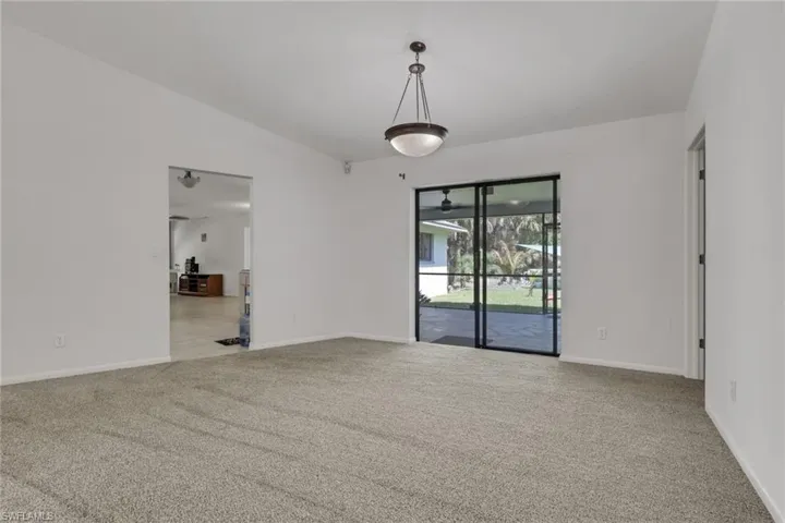 Formal dining area off the kitchen with access to the lanai.