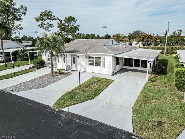 Front of 35 Dawn Flower with 2 Drive ways and carport