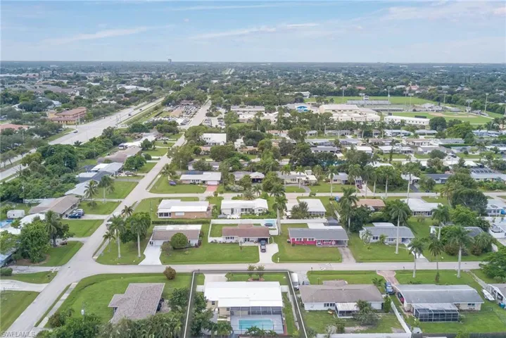 Aerial view of property's location featuring nearby suburban area