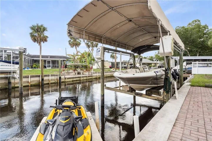Dock area featuring a water view