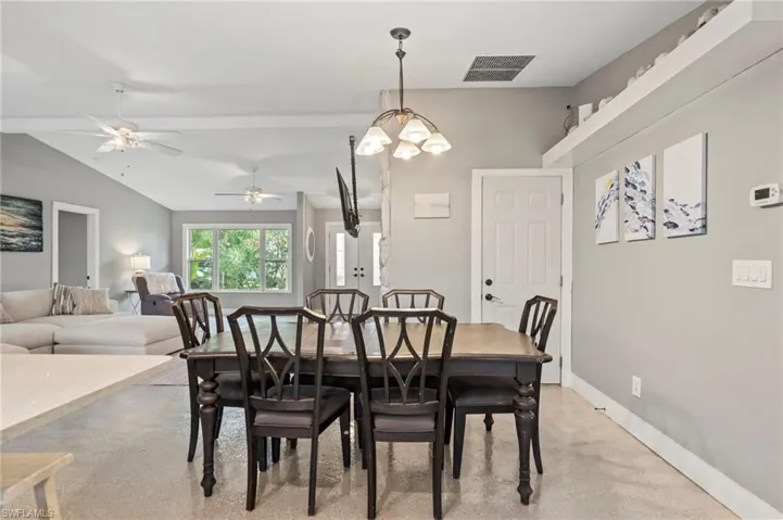 Dining room featuring vaulted ceiling