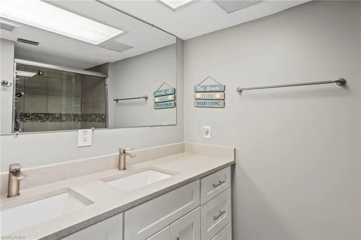 Bathroom with walk in shower and vanity