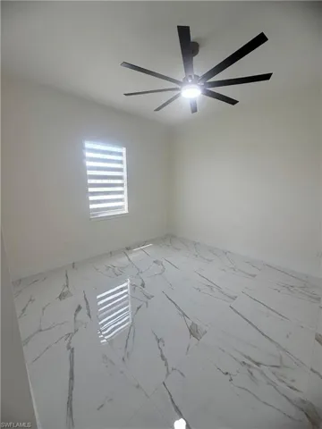 Empty room with light marble finish flooring