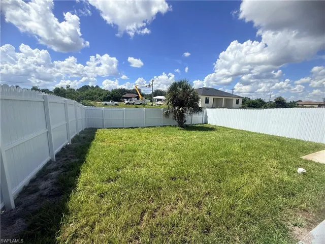 View of fenced backyard