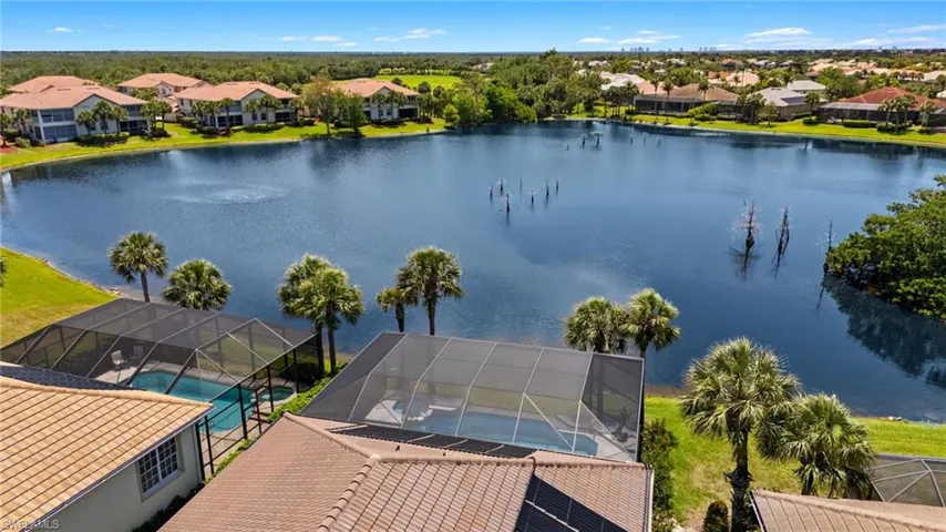 Aerial view featuring a residential view and a water view